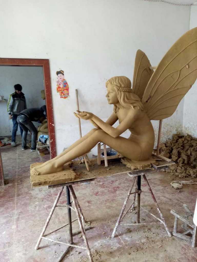 clay model of bronze angel girl statue