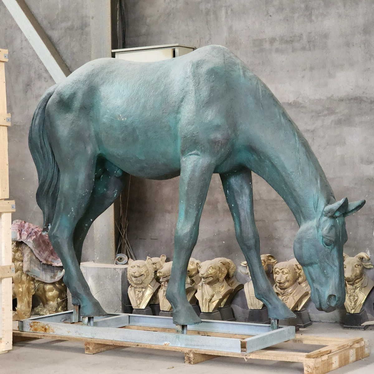 bronze sculpture of a grazing horse