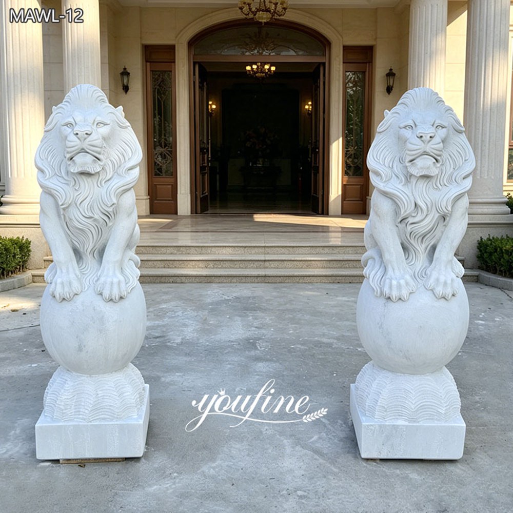Pair of Sitting Lion Statues on Ball