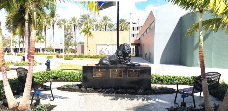 large bronze lying lion statue