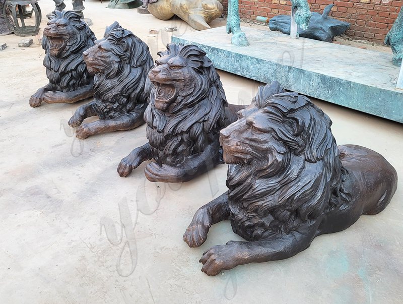 lying bronze lion statues