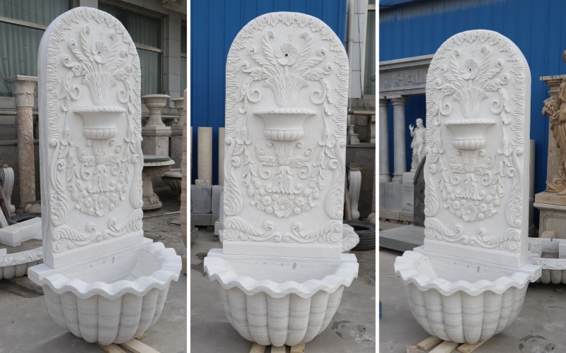 white wall hanging water fountain