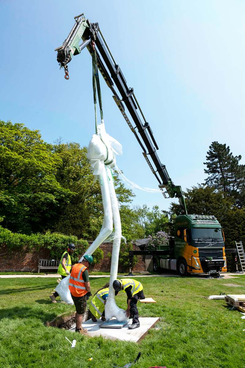 Install large bronze sculpture