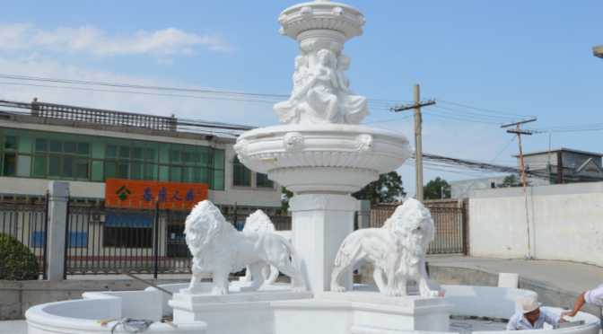 marble fountain with lion statues