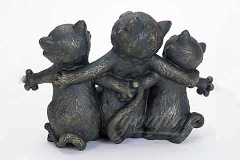 three cat statue