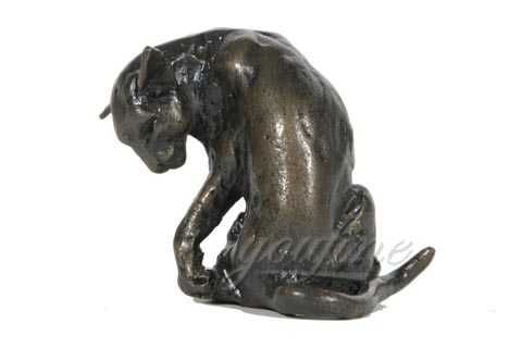 black playing cat statue