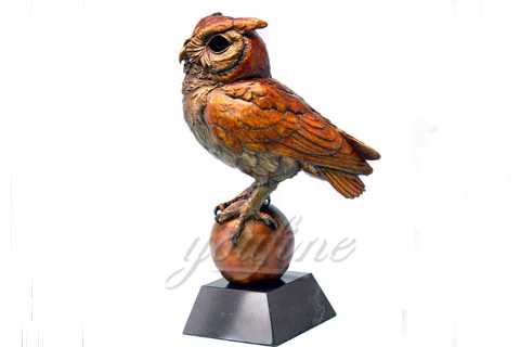 metal owl on a ball