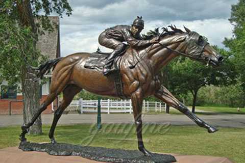 bronze statue of man riding horse