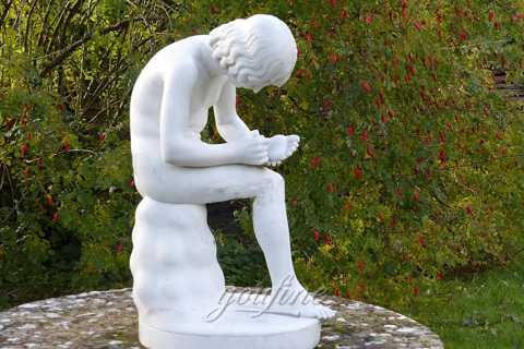 Boy with thorn garden statue