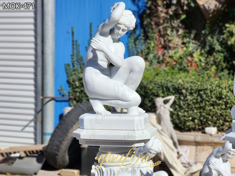 white marble carving Crouching Venus
