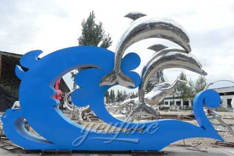 modern metal sculpture of dolphin