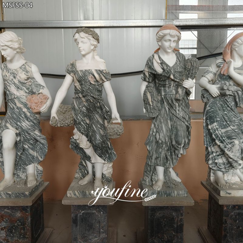 Estatuas de diosas de las cuatro estaciones en mármol gris y blanco.