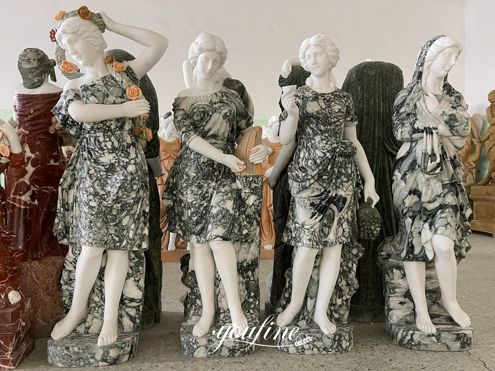 Estatuas de tamaño natural de la Diosa de las Cuatro Estaciones en mármol blanco y negro.