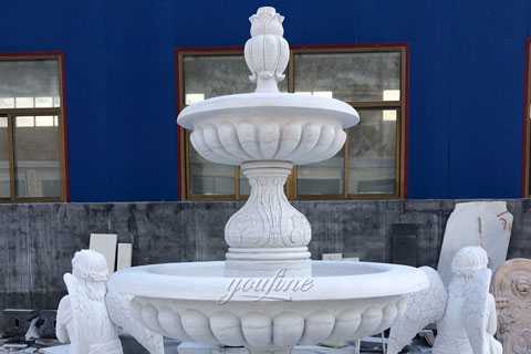 marble watre fountain with praying angel statues