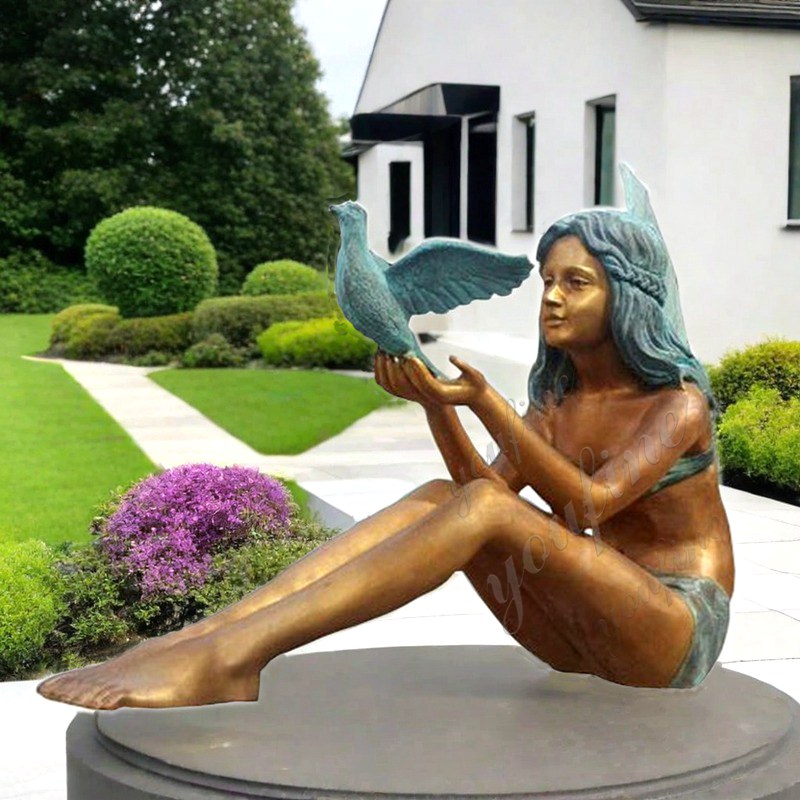 angel girl statue with dove