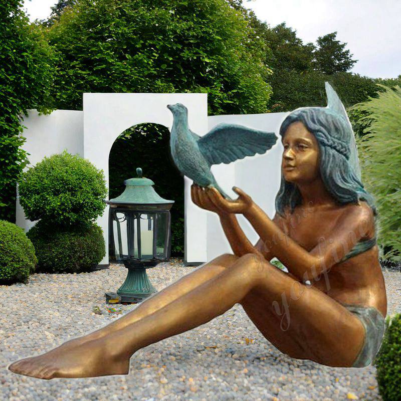 girl statue with dove