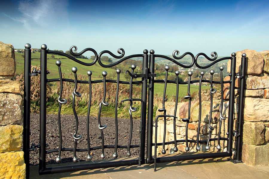 Cheap small farm casting iron swing driveway gate design for sale–IOK-196