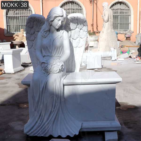 White marble angel tombstone memorials