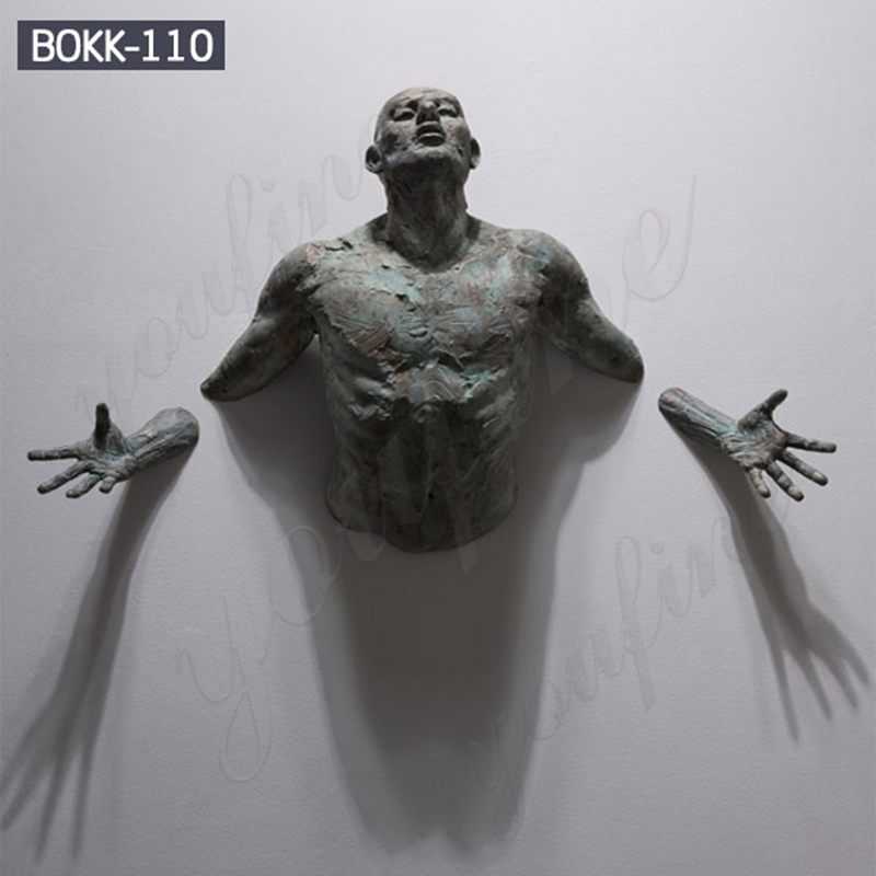 Contemporary-Bronze-Sculpture-Emerging-in-Walls-By-Matteo-Pugliese