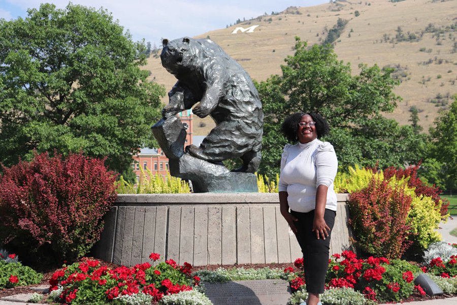montana grizzly statue with people