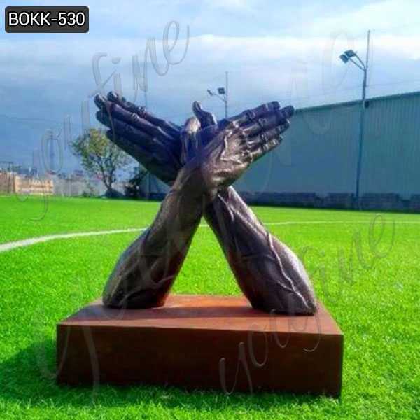 bronze butterfly hands statue