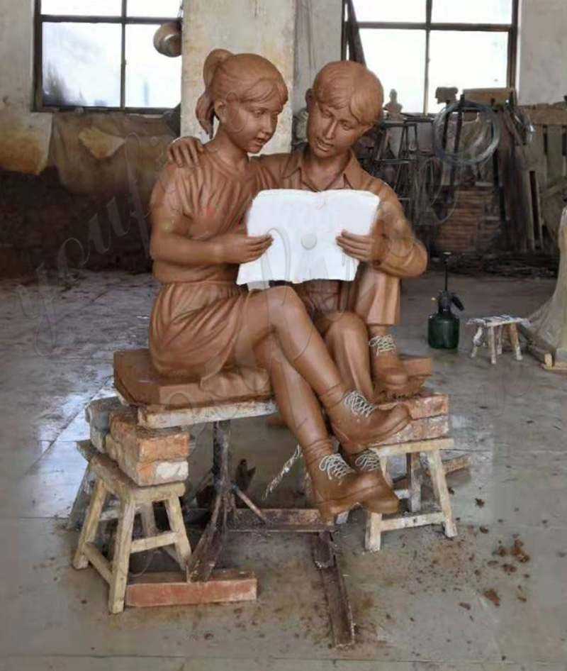 clay mold of Custom Made Kids Reading A book on Beach Bronze Statue