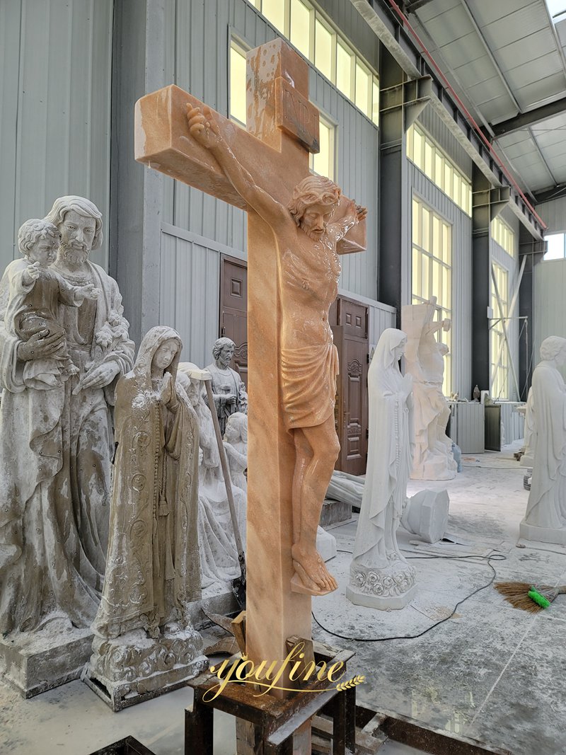 red marble Jesus Christ on the Cross statue