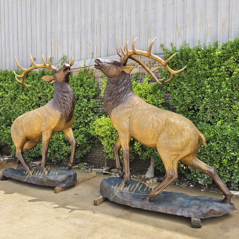 two outdoor deer statue