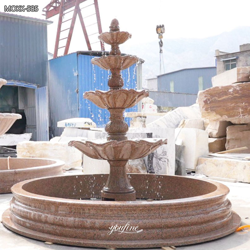 red tiered stone fountain
