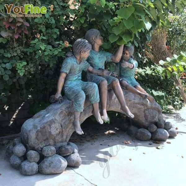Bronze Statue of Children on Log with Butterflies
