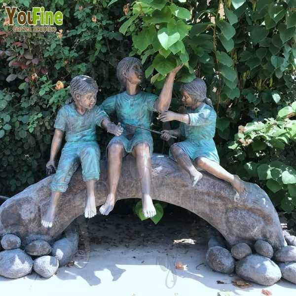 Bronze Statue of Children on Log with Butterflies for Sale