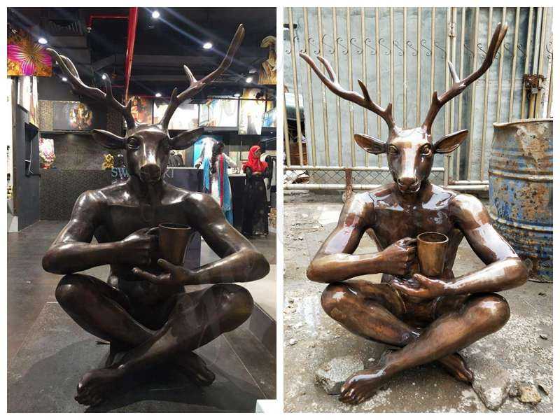 Bronze man statue with deer head