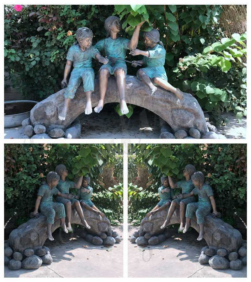 Statue of Children on Log with Butterflies
