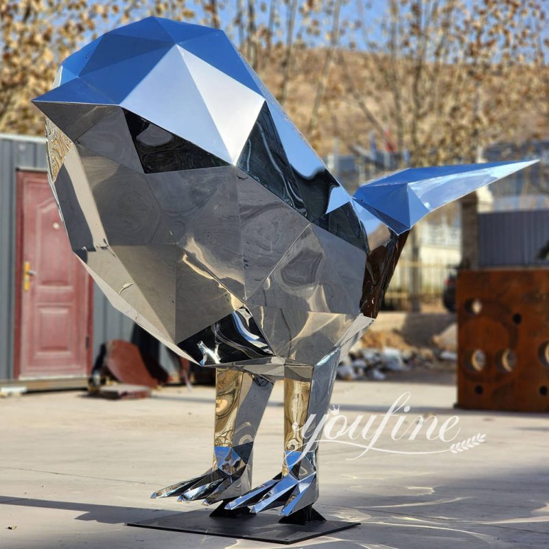 large stainless steel geometric bird sculpture