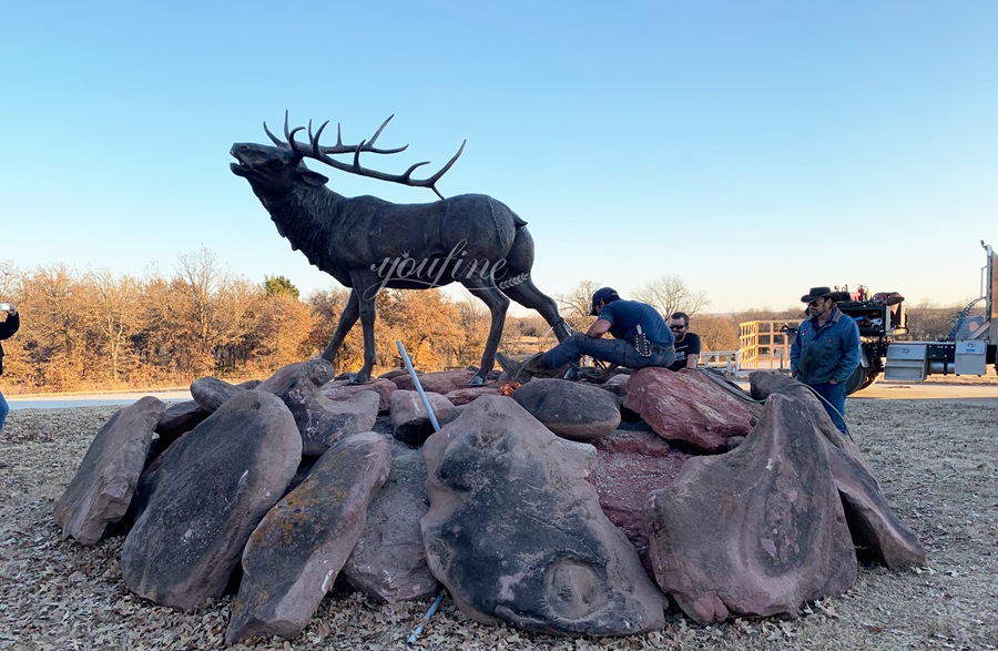 large elk bronze statue installation