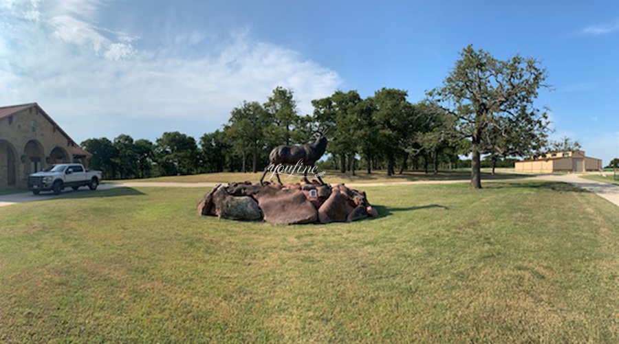 large elk statue in village