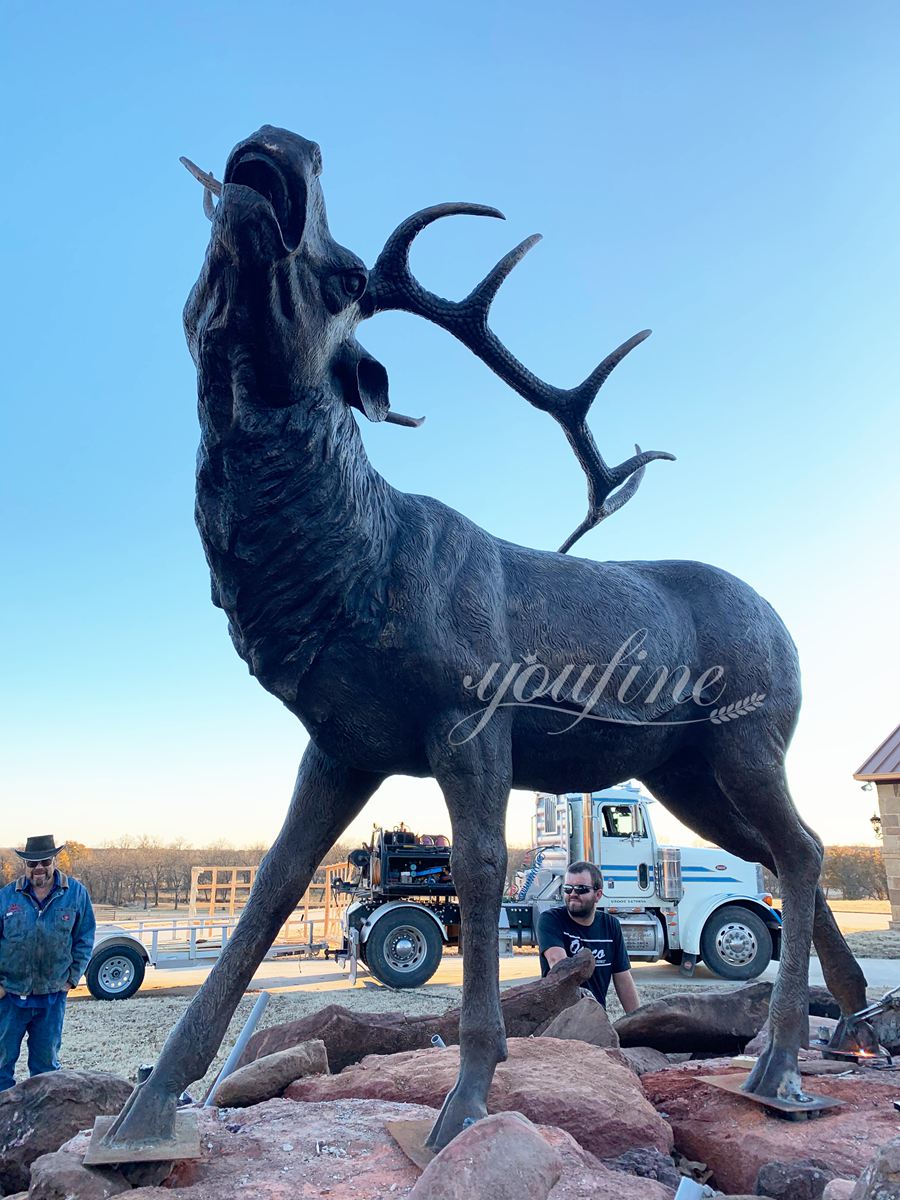 large elk statue installation