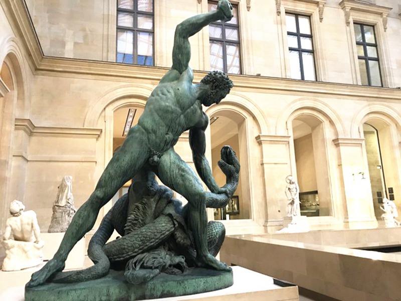 statue fighting snake