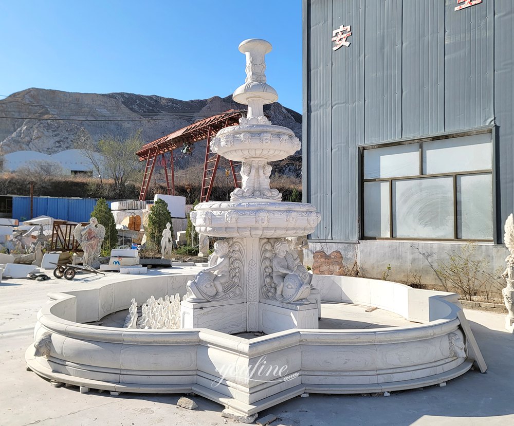 white Children and Fish Statue Fountain