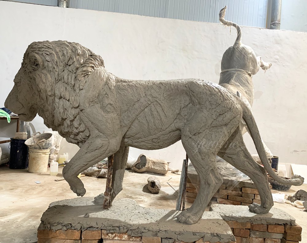 Clay model of a male lion sculpture