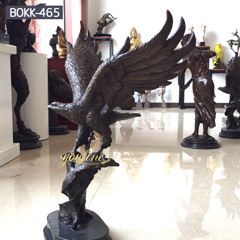 Eagle sculpture standing on a tree stump