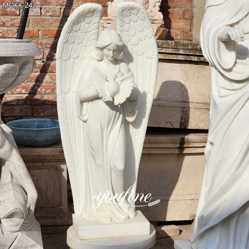 Estatua de ángel de mármol blanco con escultura de paloma