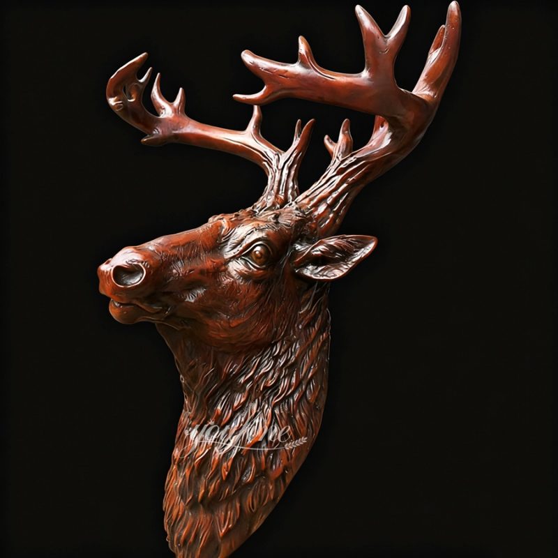 large bronze deer head on wall