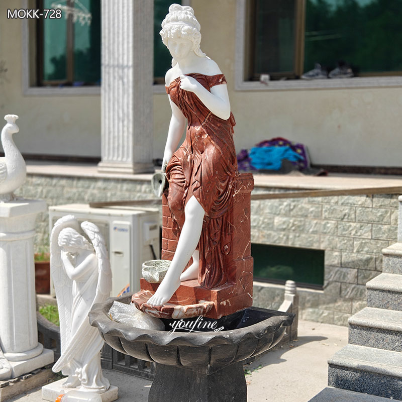 red woman fountain sculpture