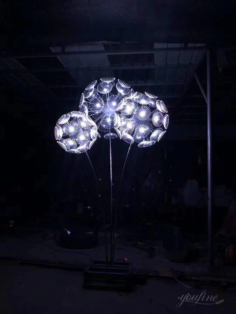 stainless steel dandelion sculpture with light
