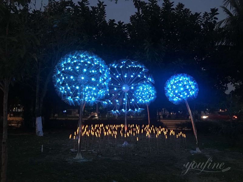 stainless steel dandelion sculpture with light