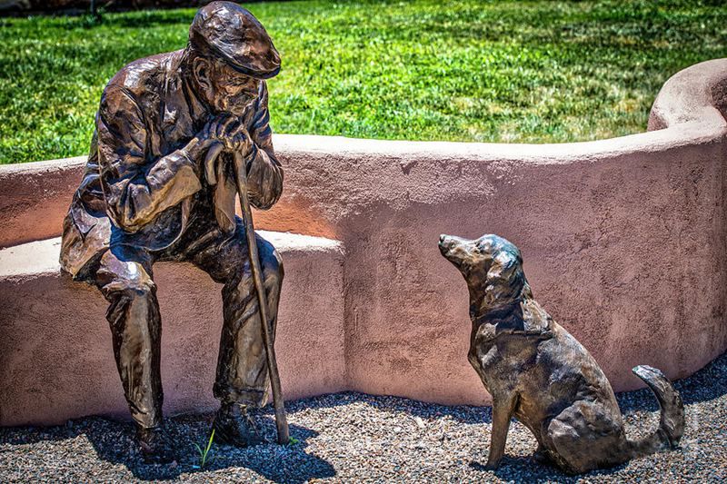 bronze little-old-man-and-dog statue