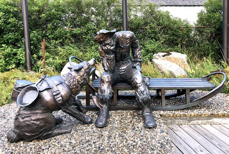 man and dog statue