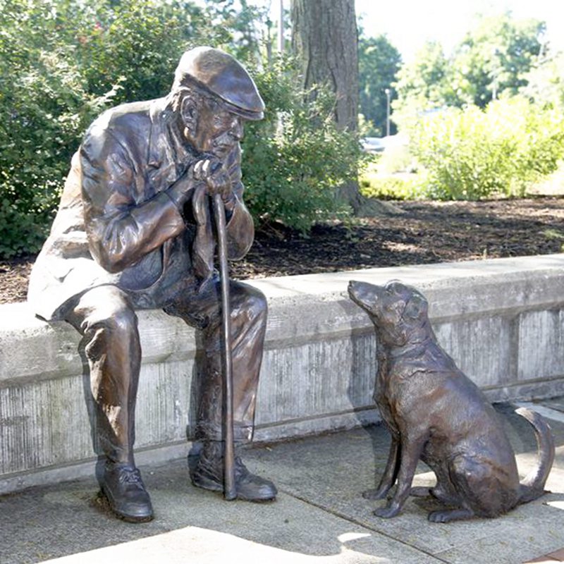 man with dog sculpture