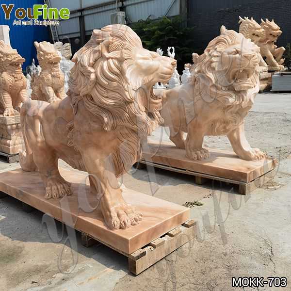 Pair of Natural Beige Marble Walking Lion Statues for Sale